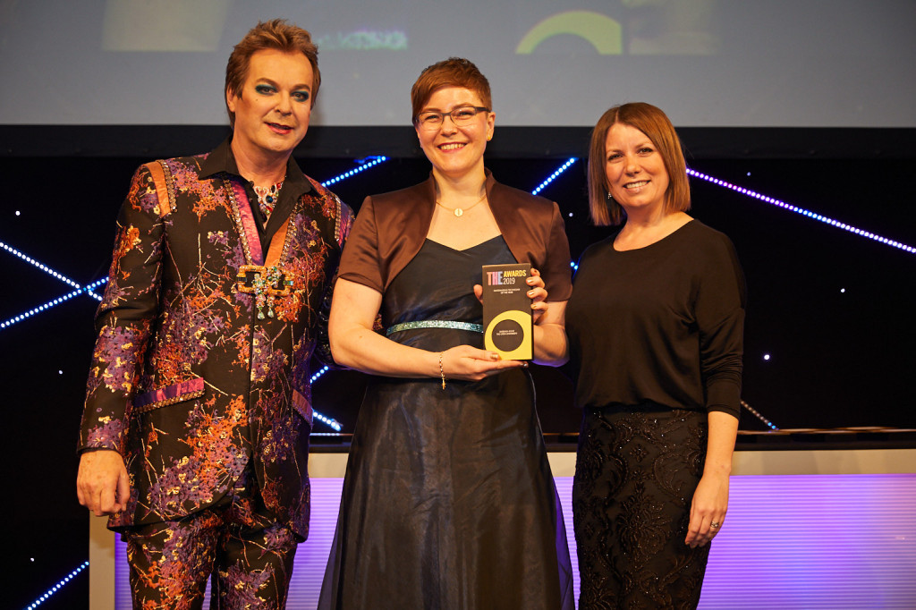 Barbara (centre) recieving the THE award with presenter Julian Clary (on the left) and Technician Commitment chair Kelly Vere (on the right)